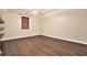 Bedroom with neutral paint, hardwood floors, and accent shelves at 4141 Willow Ridge Rd, Douglasville, GA 30135