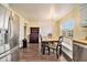 Charming dining area with hardwood floors, a built-in bench, and stainless steel appliances at 4141 Willow Ridge Rd, Douglasville, GA 30135