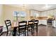 Cozy dining area with hardwood floors and a window view overlooking the backyard at 4141 Willow Ridge Rd, Douglasville, GA 30135