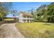 Two-story house with a double front porch and a long driveway leading to a carport at 4141 Willow Ridge Rd, Douglasville, GA 30135