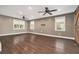 Bright living room featuring hardwood floors, ceiling fans, and ample natural light at 4141 Willow Ridge Rd, Douglasville, GA 30135