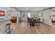 Basement with an entertainment area, dinning table, bar seating and light wood floors at 112 Bluestone Ct, Acworth, GA 30101
