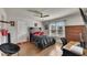 Bedroom has hardwood floors, ceiling fan, a large window, and sports-themed decor at 112 Bluestone Ct, Acworth, GA 30101