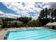 Large community pool with lounge chairs and umbrellas at 112 Bluestone Ct, Acworth, GA 30101