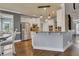 Eat-in kitchen with granite countertops, stainless steel appliances, and stylish pendant lighting at 112 Bluestone Ct, Acworth, GA 30101