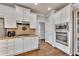 Beautiful kitchen with stainless steel appliances, granite countertops, and ample cabinet space at 112 Bluestone Ct, Acworth, GA 30101