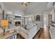 Cozy living room with fireplace, high ceilings, and beautiful hardwood floors at 112 Bluestone Ct, Acworth, GA 30101