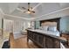 Spacious main bedroom with trey ceilings, a wooden bed frame, hardwood floors, and lots of natural light at 112 Bluestone Ct, Acworth, GA 30101