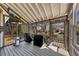 Covered and screened-in patio with two covered grills and seating area at 112 Bluestone Ct, Acworth, GA 30101