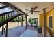 Covered brick patio with ceiling fans and comfortable outdoor seating at 112 Bluestone Ct, Acworth, GA 30101