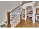 Elegant staircase with dark wood and white trim, leading to the upper levels of the home at 112 Bluestone Ct, Acworth, GA 30101