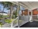 View from back porch shows brick exterior, white railing, and view of backyard at 32 Howell Se St, Atlanta, GA 30312