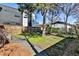 Backyard shows grassy and graveled areas, a fence, and a view of adjacent homes at 32 Howell Se St, Atlanta, GA 30312