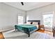 Serene bedroom with neutral colors, hardwood floors, and abundant natural light for a peaceful retreat at 32 Howell Se St, Atlanta, GA 30312