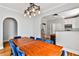 Open dining area with wood floors and lighting, adjacent to the kitchen at 32 Howell Se St, Atlanta, GA 30312