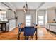 Open dining space showcasing beautiful hardwood floors and a stylish light fixture at 32 Howell Se St, Atlanta, GA 30312