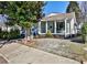 Charming cottage-style home with a covered front porch and landscaping at 32 Howell Se St, Atlanta, GA 30312