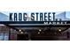 Exterior shot of the entrance to Krog Street Market with bright signage, showcasing its vibrant atmosphere at 32 Howell Se St, Atlanta, GA 30312