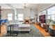 Open living room with hardwood floors, gray paint, and a brick fireplace at 32 Howell Se St, Atlanta, GA 30312