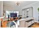 Comfortable living room featuring hardwood floors, modern lighting, and ample natural light at 32 Howell Se St, Atlanta, GA 30312