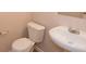 Compact bathroom with a white toilet and pedestal sink at 5171 Hanover St, Atlanta, GA 30349