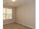Bedroom with a view from the window and neutral-colored carpet at 5171 Hanover St, Atlanta, GA 30349