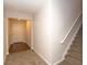 Hallway featuring plush carpeting on the stairs and light-colored walls at 5171 Hanover St, Atlanta, GA 30349