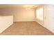 The living room features plush carpeting and a door leading to the outside at 5171 Hanover St, Atlanta, GA 30349