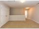 Neutral loft area with carpet, white trim, and a closet for storage at 5171 Hanover St, Atlanta, GA 30349