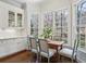 Bright breakfast nook featuring built-in cabinets, natural light, and hardwood floors at 1811 Paces Ferry Se Ct, Smyrna, GA 30080