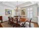 Traditional dining room with hardwood floors, area rug, beautiful artwork, and a chandelier at 1811 Paces Ferry Se Ct, Smyrna, GA 30080