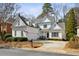 Inviting two-story home featuring white siding, manicured landscaping, and a spacious driveway at 1811 Paces Ferry Se Ct, Smyrna, GA 30080