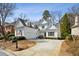 Inviting two-story home featuring white siding, manicured landscaping, and a spacious driveway at 1811 Paces Ferry Se Ct, Smyrna, GA 30080