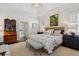 Serene main bedroom with tray ceiling, sitting area, and ensuite bathroom at 1811 Paces Ferry Se Ct, Smyrna, GA 30080