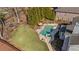 Aerial view of a well-maintained backyard with a pool, spa, and lush green lawn at 3323 Acorn Falls Dr, Marietta, GA 30062