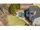 Gorgeous aerial shot of backyard featuring in-ground pool, spa, lounging area, and lush landscaping at 3323 Acorn Falls Dr, Marietta, GA 30062