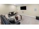 Finished basement featuring comfortable seating and a large TV at 3323 Acorn Falls Dr, Marietta, GA 30062