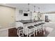 Wet bar in basement featuring granite countertops, white cabinets, and pendant lighting at 3323 Acorn Falls Dr, Marietta, GA 30062