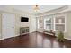 Bright bedroom with hardwood floors, natural light, and a tray ceiling at 3323 Acorn Falls Dr, Marietta, GA 30062