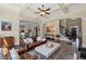 Comfortable living room showcasing a coffered ceiling, fireplace, and open layout to the kitchen and staircase at 3323 Acorn Falls Dr, Marietta, GA 30062