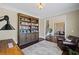 Inviting living room showcasing a bookshelf, hardwood floors, and an open floor plan at 3323 Acorn Falls Dr, Marietta, GA 30062