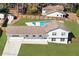 Aerial view of the home showcasing its large backyard, in-ground swimming pool, and privacy fence at 4554 Mountain Creek Ne Dr, Roswell, GA 30075