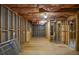 Unfinished basement with exposed ceiling insulation and framing ready for customization at 11385 Donnington Dr, Duluth, GA 30097