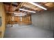 Unfinished basement area featuring exposed insulation, concrete walls, and basic framing at 11385 Donnington Dr, Duluth, GA 30097
