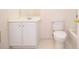 Standard bathroom featuring a toilet, sink with vanity, and mirror at 11385 Donnington Dr, Duluth, GA 30097