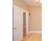 Bedroom with hardwood floors and an open door at 11385 Donnington Dr, Duluth, GA 30097