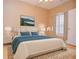 Bedroom with modern decor featuring a large bed, dresser, and nightstand at 11385 Donnington Dr, Duluth, GA 30097