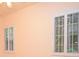 The bedroom is naturally lit by two shuttered windows at 11385 Donnington Dr, Duluth, GA 30097