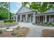 A welcoming clubhouse entrance with well-manicured landscaping and elegant architectural details at 11385 Donnington Dr, Duluth, GA 30097