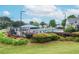 A community pool and recreational area with a sunbathing area and shady gazebos at 11385 Donnington Dr, Duluth, GA 30097